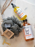 Nature's Natural Lather Mango Guava Body and Bath Care Bundle with handcrafted natural liquid soap, body oil with rosehip and jojoba oil, and bath loofa sponge. Perfect for self care bath soaks and luxurious gift for him or her.