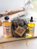 Nature's Natural Lather Mango Guava Body and Bath Care Bundle with handcrafted natural liquid soap, body oil with rosehip and jojoba oil, and bath loofa sponge. Perfect for self care bath soaks and luxurious gift for him or her.