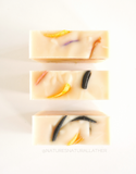 Nature's Natural Lather Sweet Orange Lemongrass Essential Oil scented Soap Bar made with all natural plant based ingredients including red clay, kaolin clay, activated charcoal, shea butter, cocoa butter and more and scented with Tea Tree Essential Oil and Sweet Orange Essential Oil. Plant Based Vegan Soap Bars For Sensitive Skin.